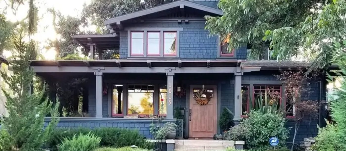Craftsman home at dusk with a warm lit porch